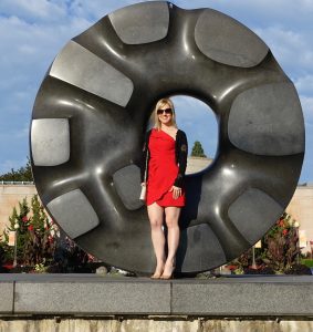 Red dress at an Isamu Nochuchi sculpture