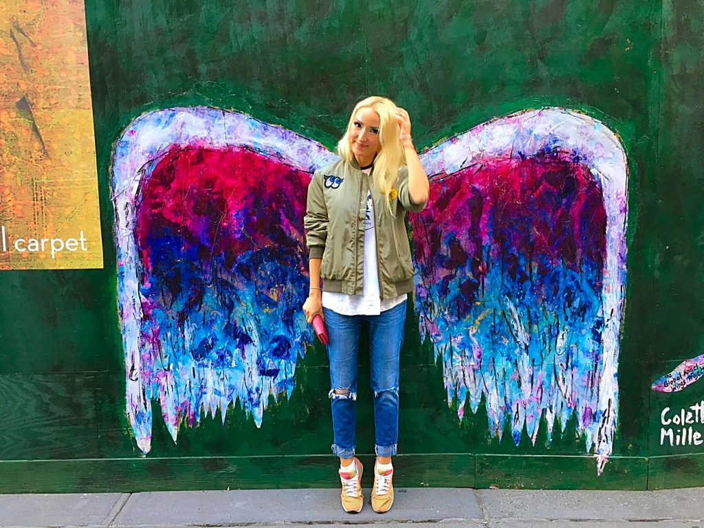 Liliya in front of the wings graffiti