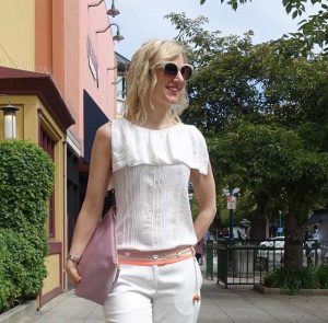 Close-up of white pants outfit